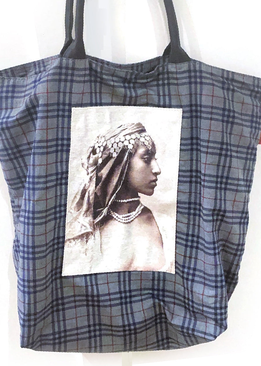 Large tout bag with a picture of a woman on it.