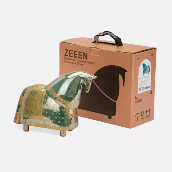 The horse statue beside its box.