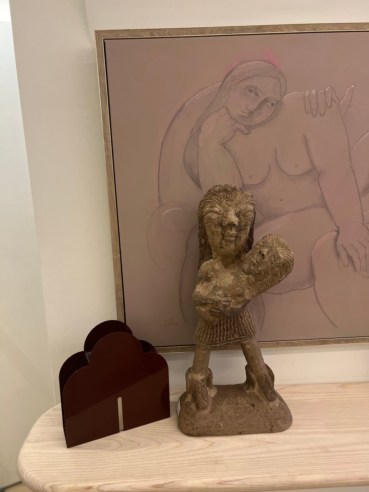 Papier Mache Sculpture; a mother holds her baby in her arms.