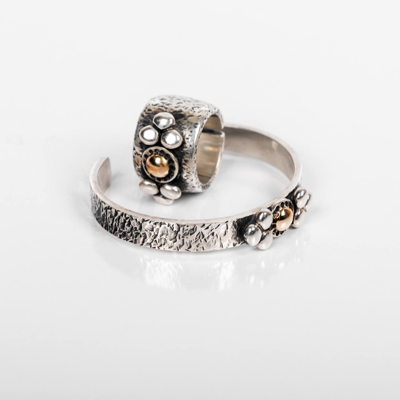 The ring and bracelet with same design.