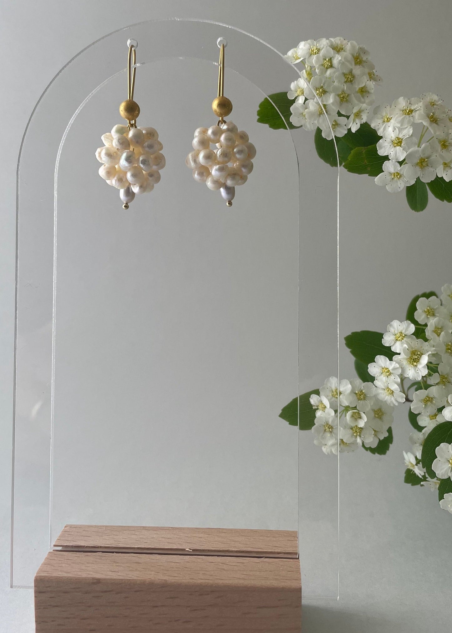 very small pearls and gold earrings.