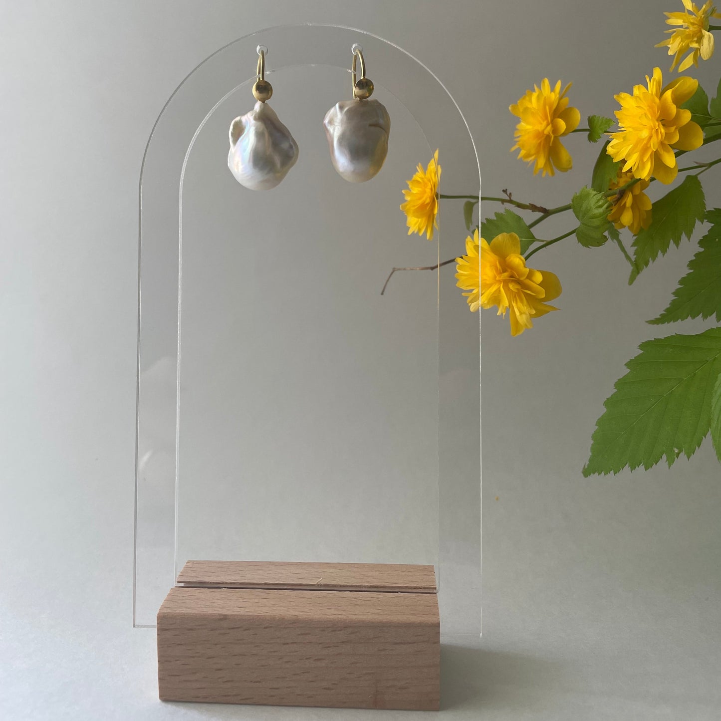 Baroque pearls and gold earrings.