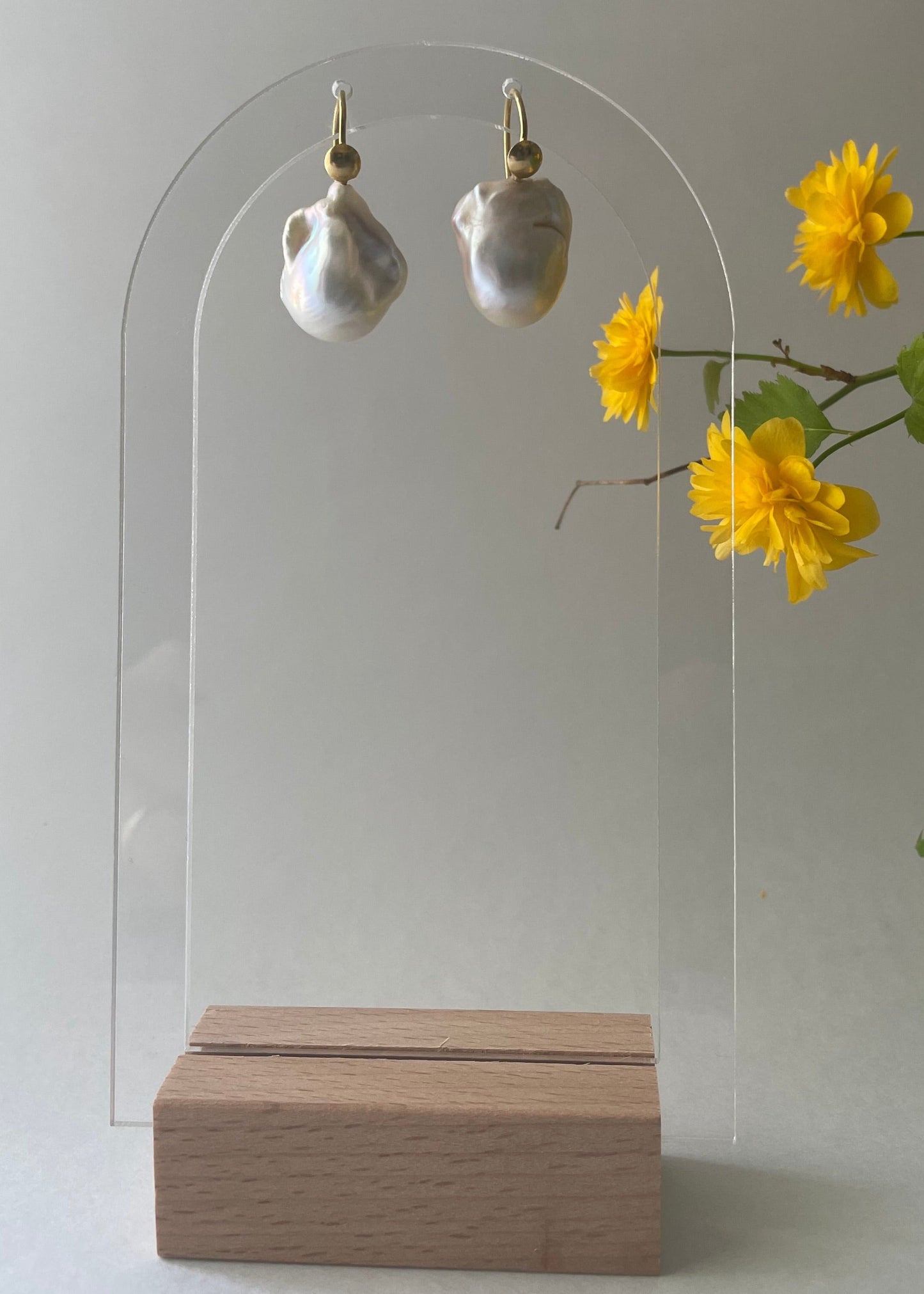 Baroque pearls and gold earrings.