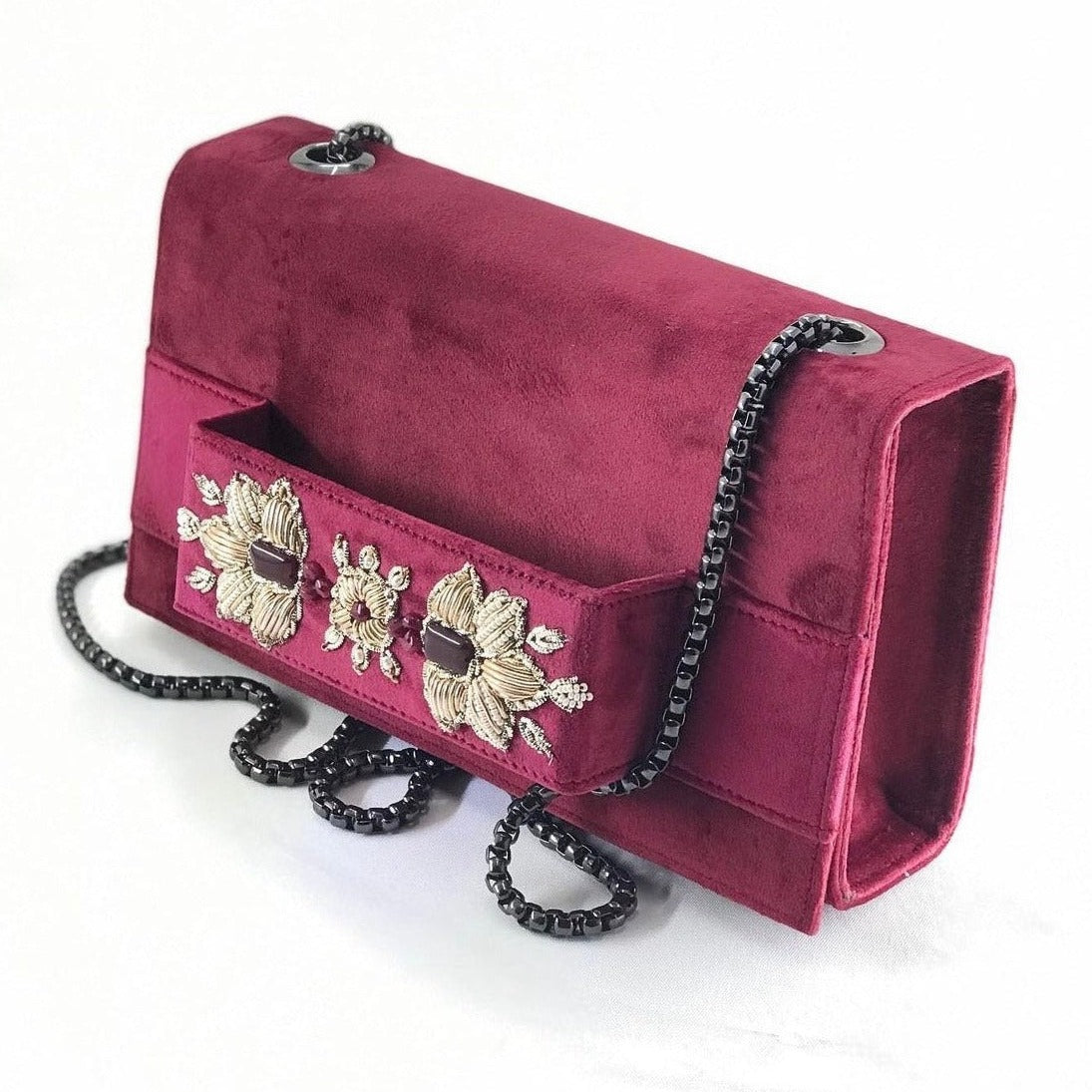 Dark red clutch with embroidery and beads.