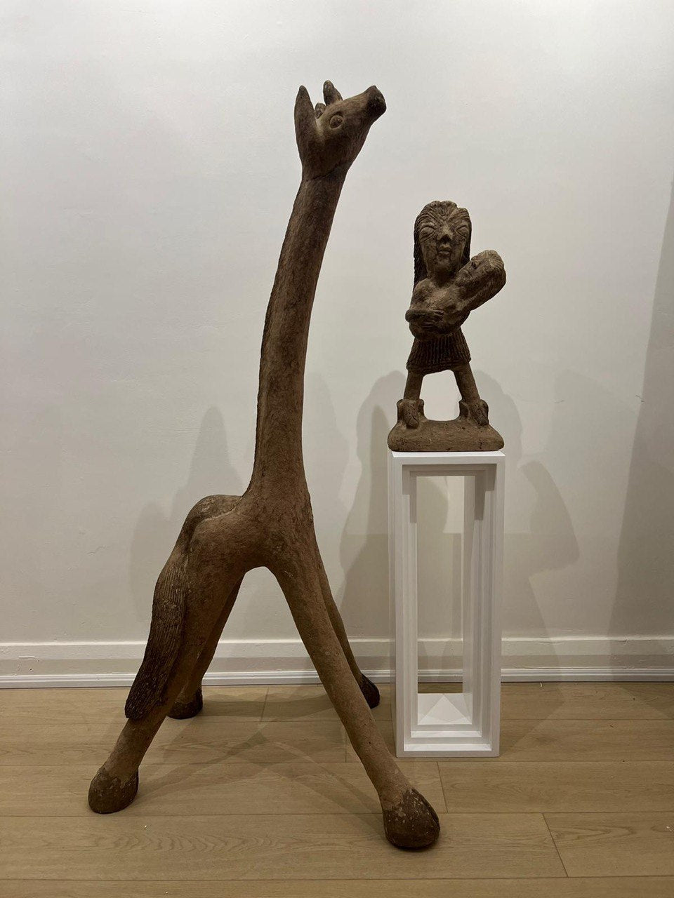 Brown papier-mâché giraffe statue- Medium