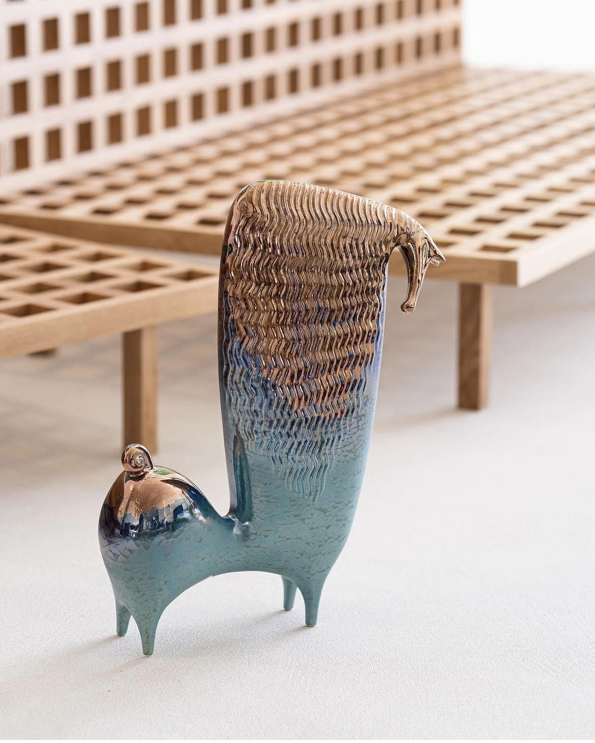 Turquoise horse statue with gold pattern