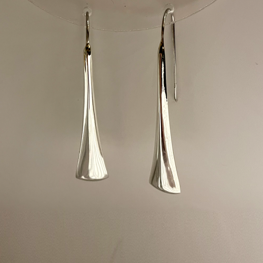 Long three angle earrings.