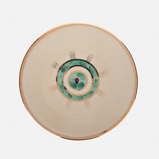 Beige ceramic plate with golden edge and eye design.