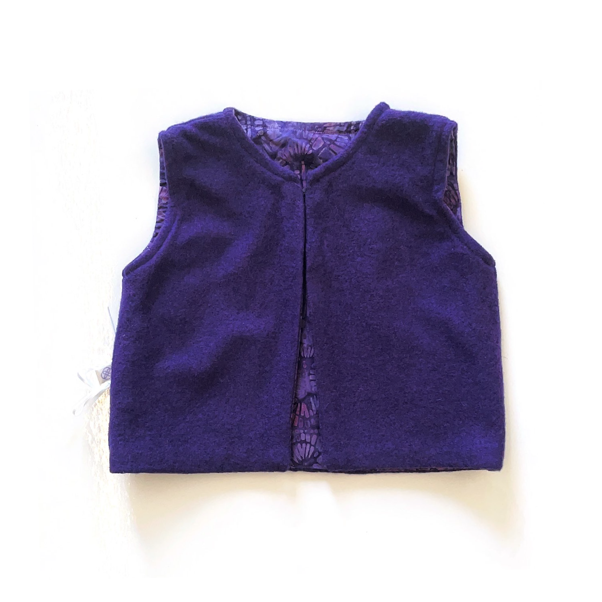 Dark purple vest with purple tonnage lining.