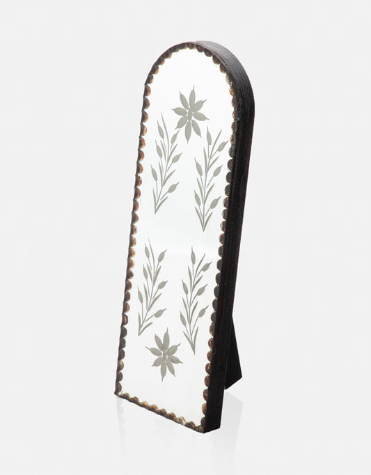 Mirror with carving pattern.