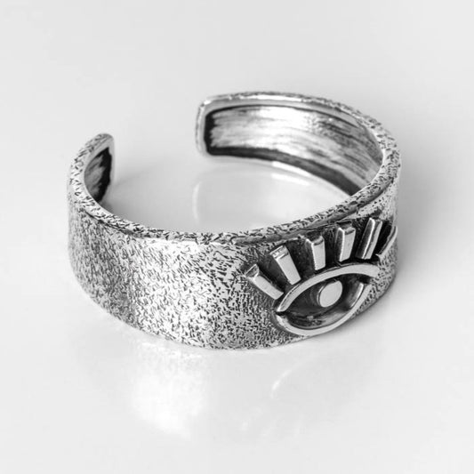 Wide cuff bracelet with eye design.