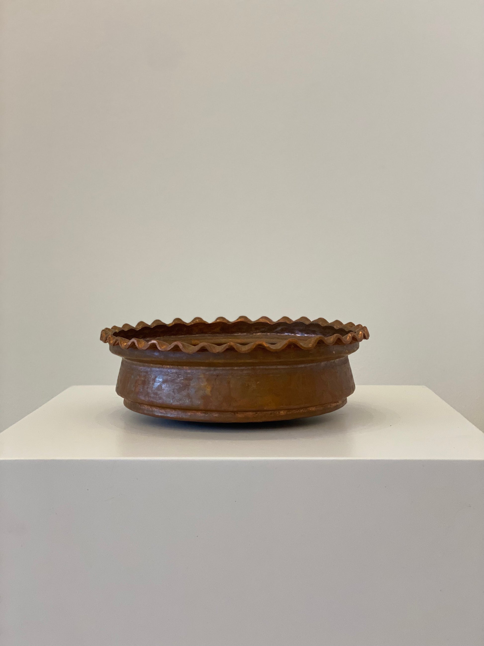 copper colored copper bowl with congress edge.