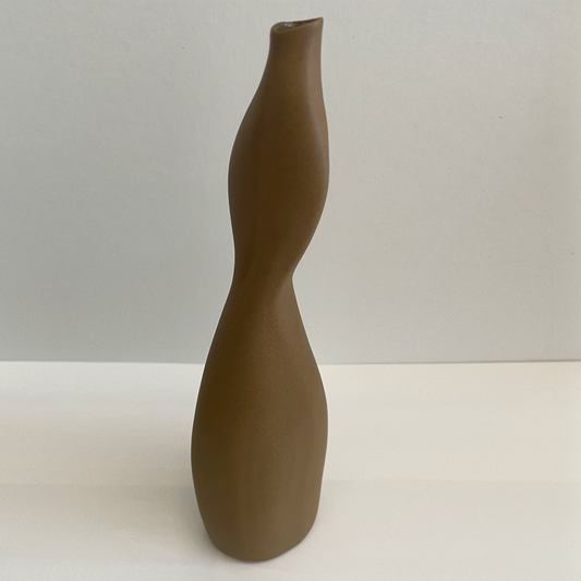 Brown Thin vase with asymmetric shape.