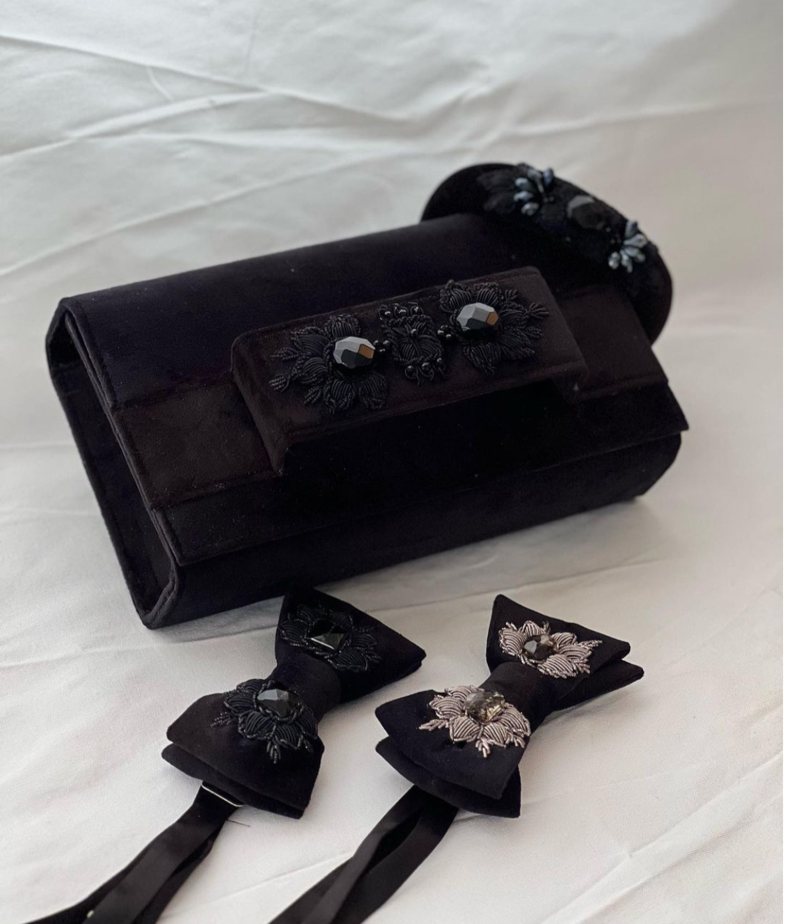 Black velvet clutch with embroidery and beads.