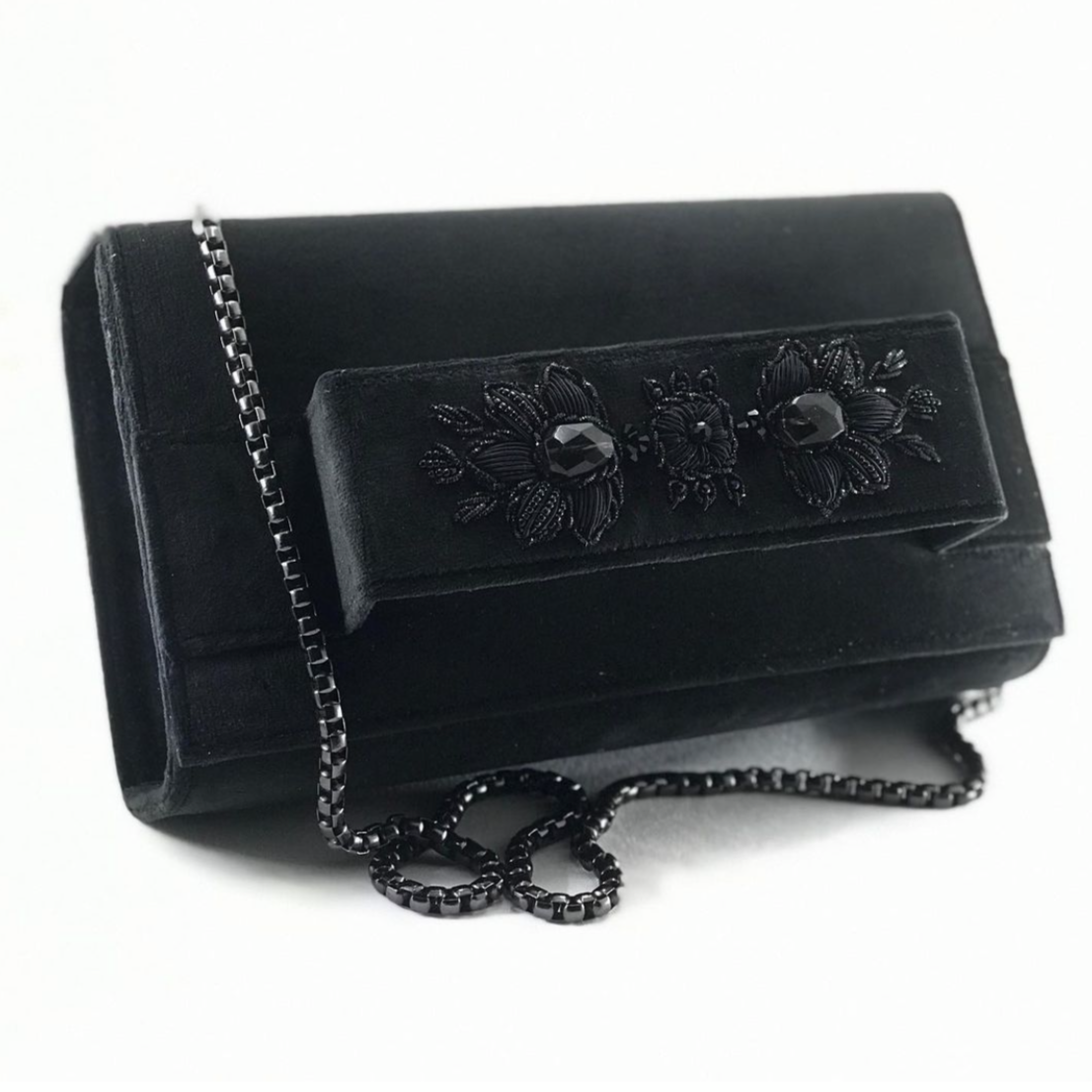 Black velvet clutch with embroidery and beads.