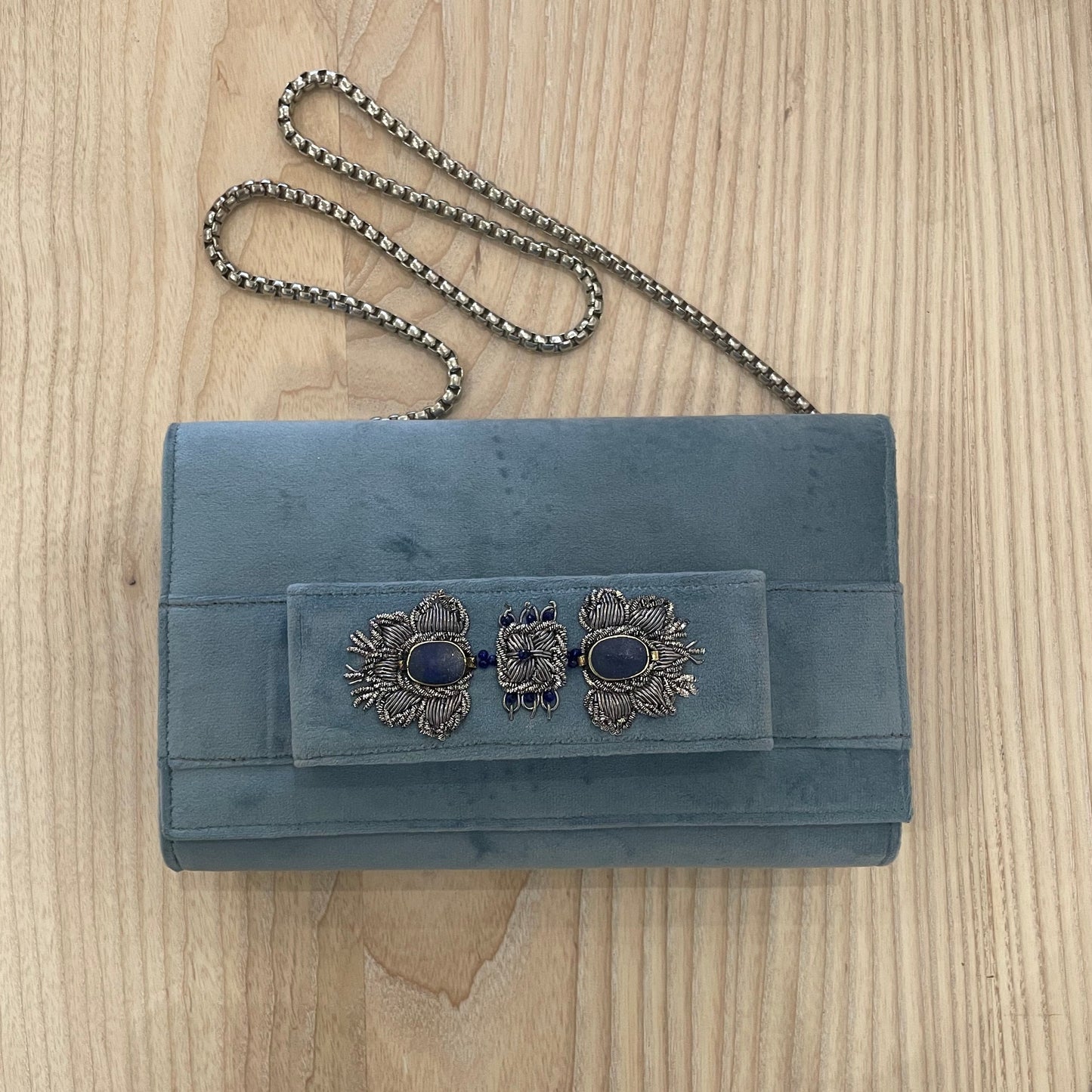 Light blue velvet clutch with embroidery and beads.