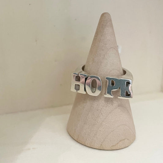 Silver Ring become in the shape of Hope inscription.