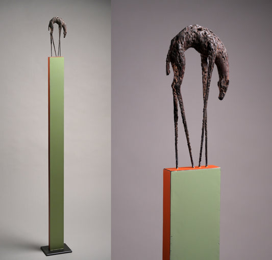 Steel sculpture, a hunchback animal with long and thin feet.