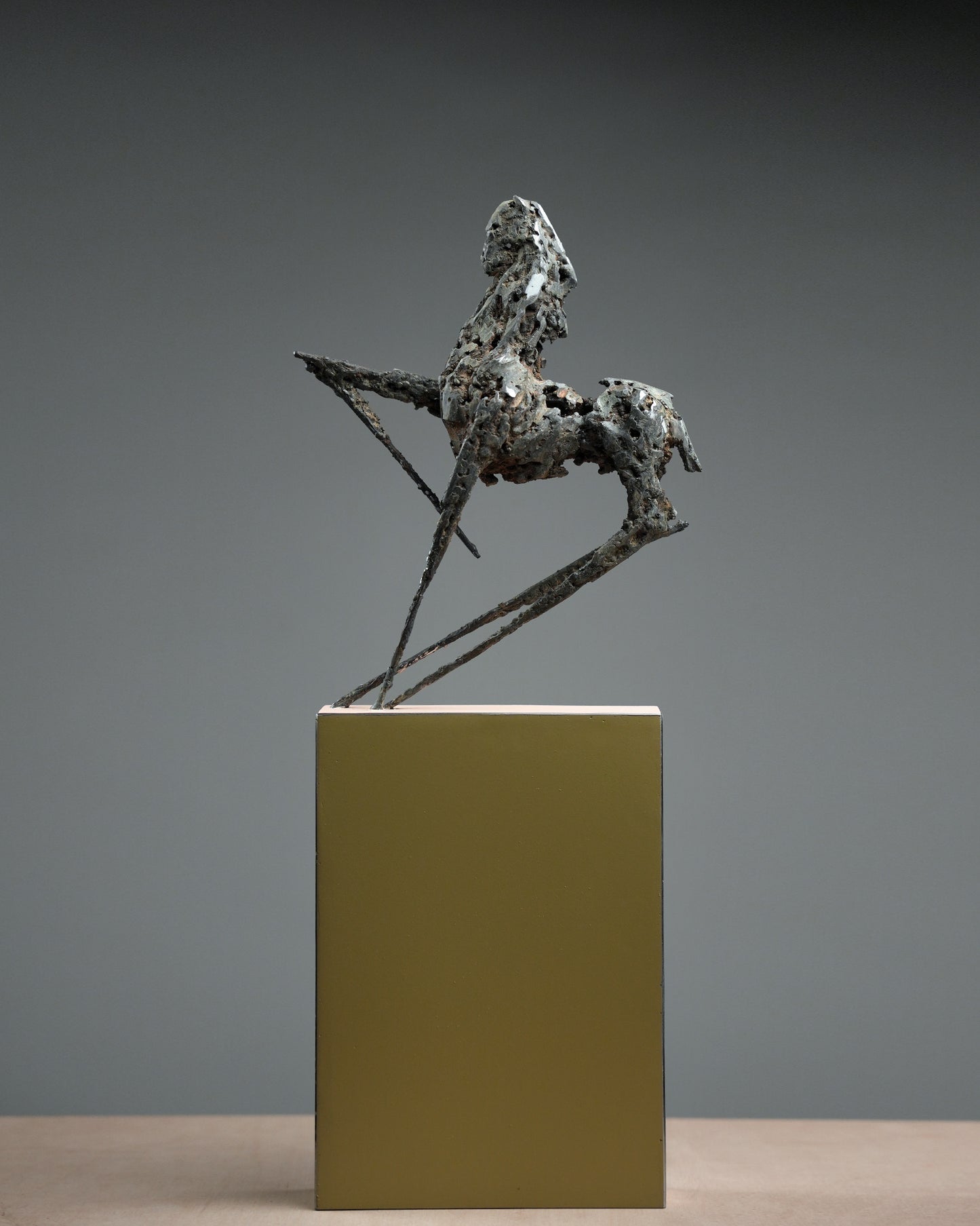 Steel horse sculpture with thin and sharp feet.