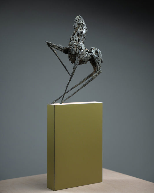 Steel horse sculpture with thin and sharp feet.