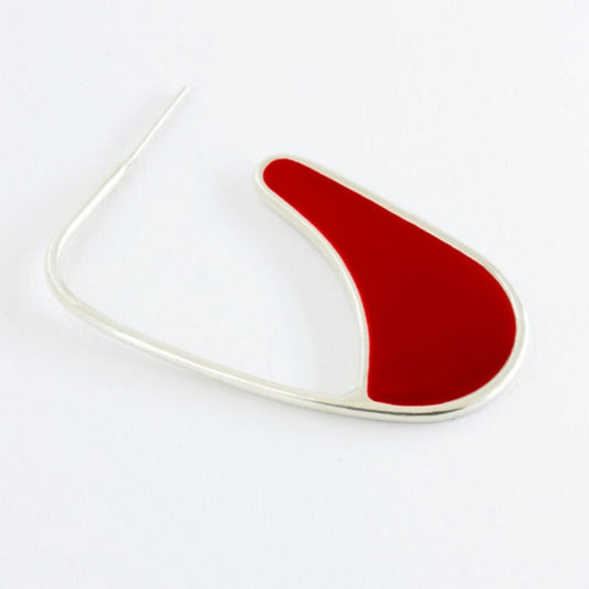 Silver earring filed with red epoxy resin.