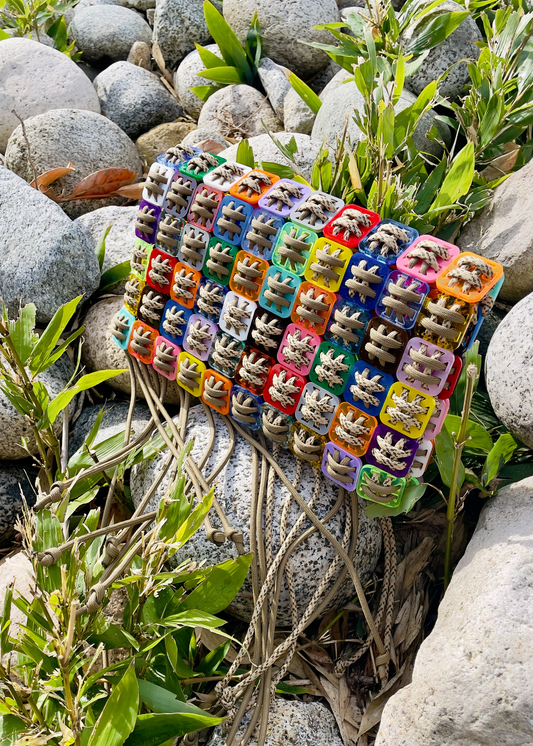 Handcrafted pixel clutch in laser-cut acrylic and cord by Studio Jazbi