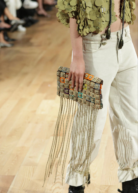 Handcrafted pixel clutch in laser-cut wood, acrylic, and cord by Studio Jazbi