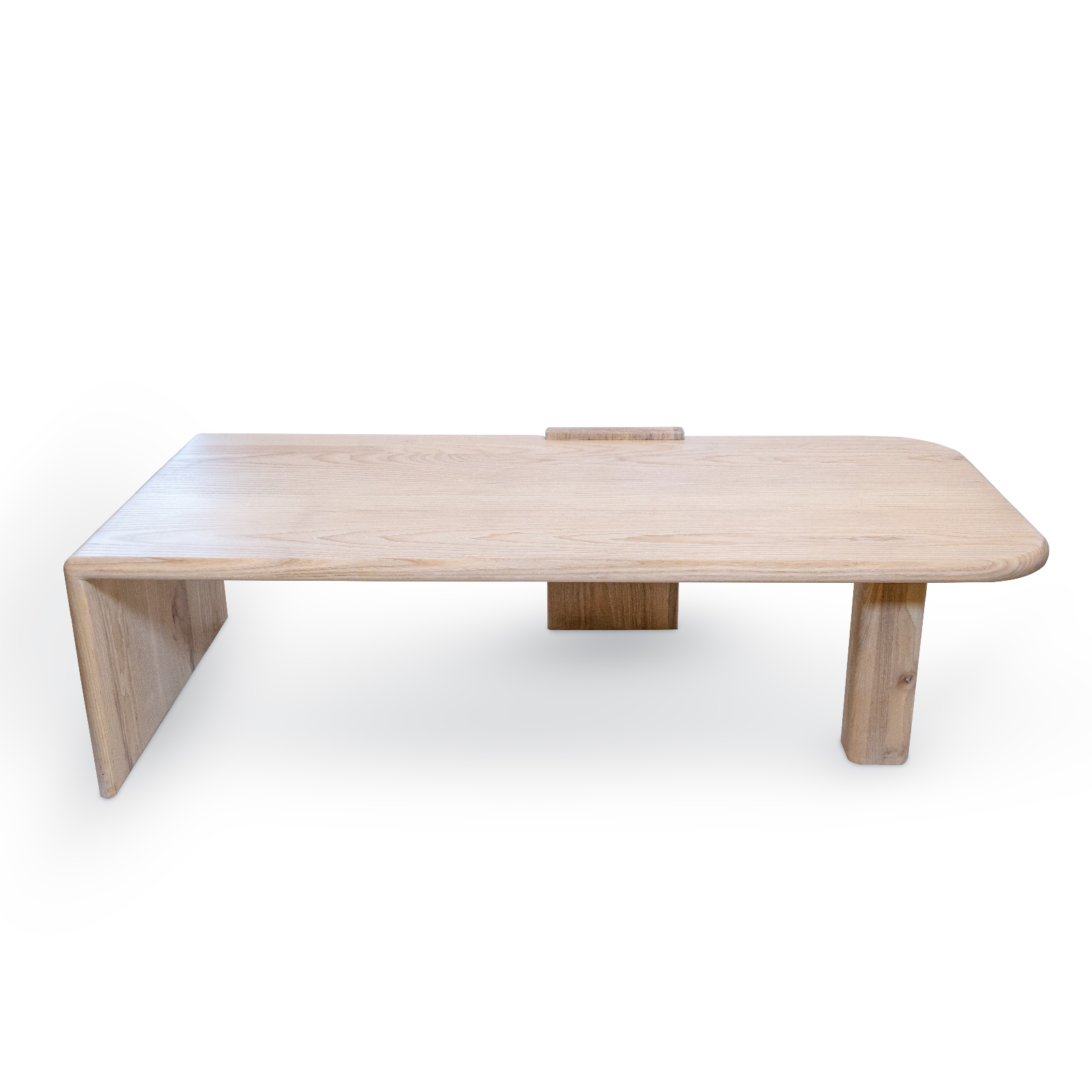 modern wooden coffee table: Rectangular surface with rounded corners and a natural pale wood color. One leg extends from one side perpendicularly, while another leg is positioned opposite, with a third leg running along the length of the table