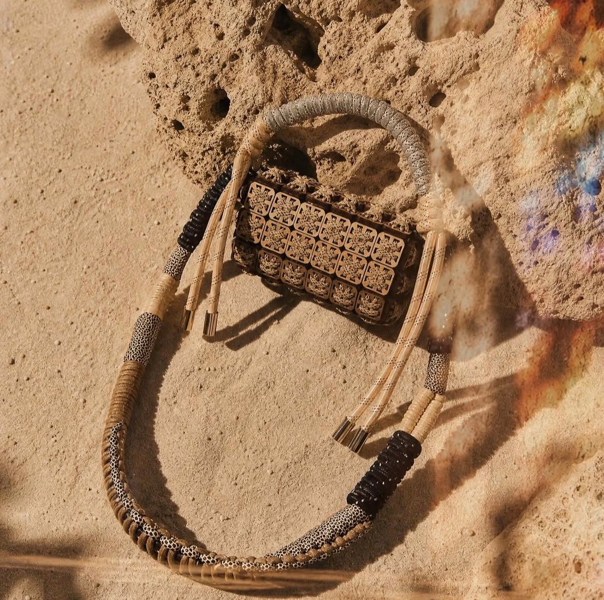 Handcrafted pixel bag in laser-cut wood and cord by Studio Jazbi