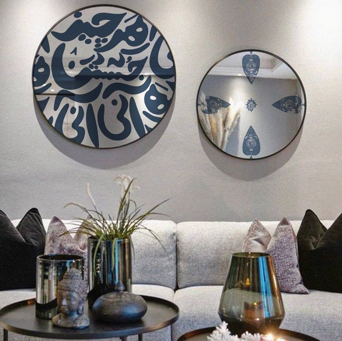 Circle mirror with metal frame and digital print on wall.