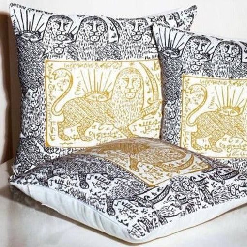 cushion whit yellow lion design and gray border. 