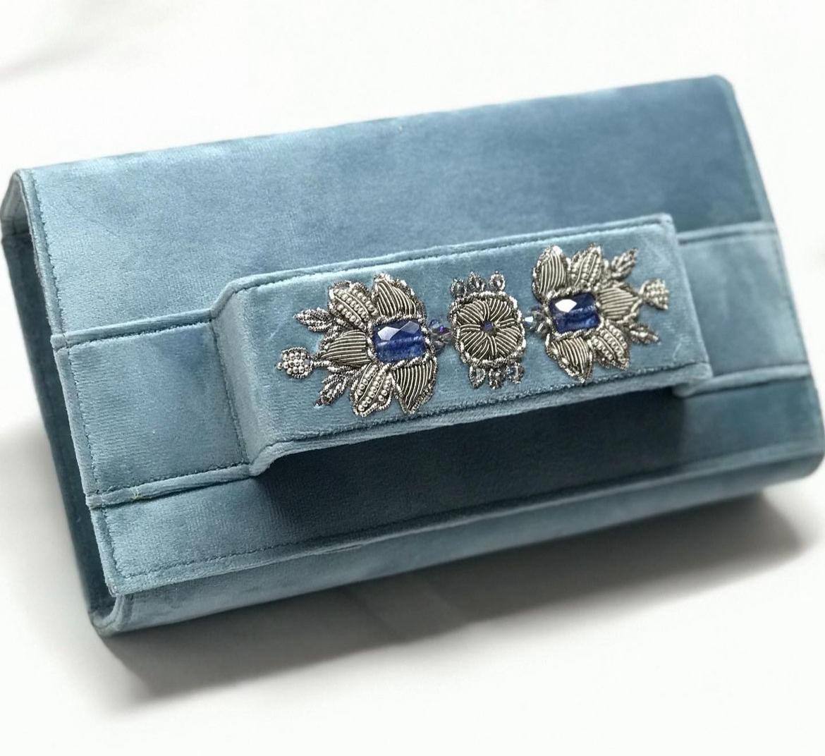 Light blue velvet clutch with embroidery and beads.