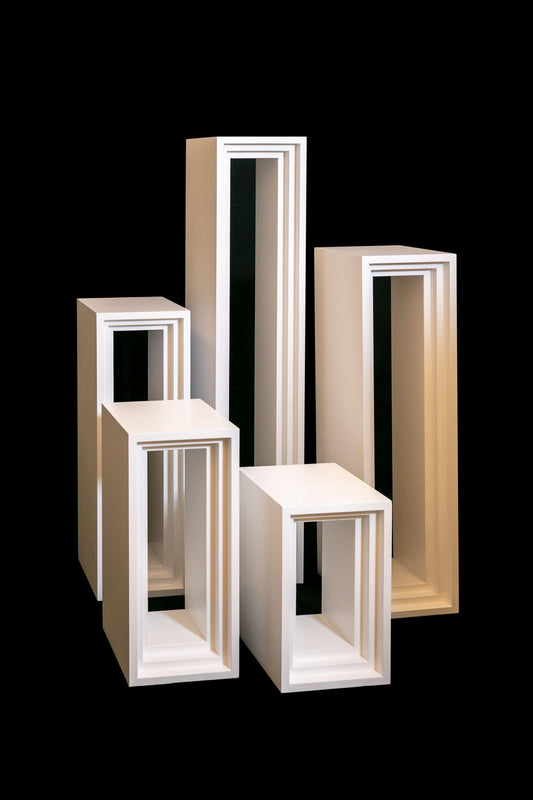 Five wooden stands in different height.